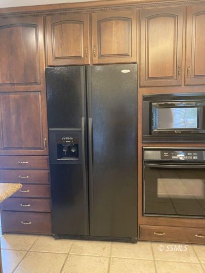 1006 North Sierra View Street Ridgecrest, CA 93555 - Photo 7 of 36 a kitchen with granite countertop stainless steel appliances and cabinets