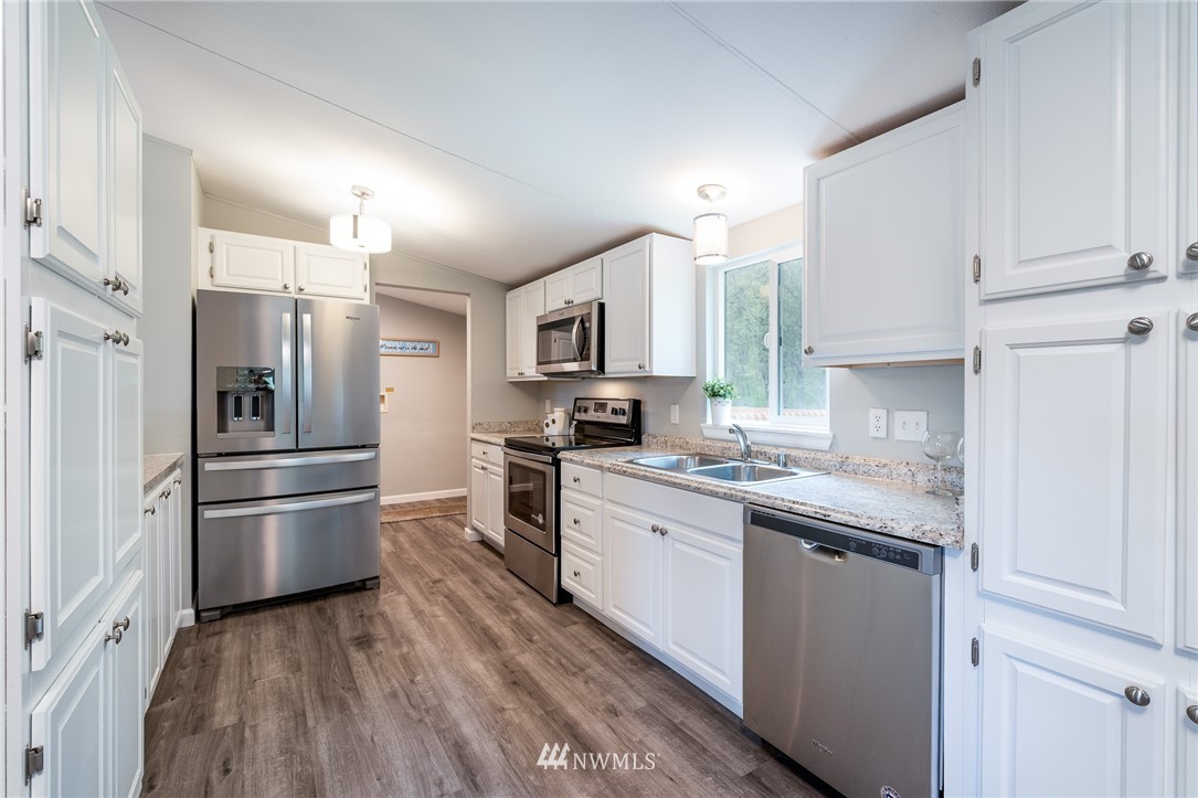 7992 Ham Road Custer, WA 98240 - Photo 11 of 31 a kitchen with a refrigerator stove and sink