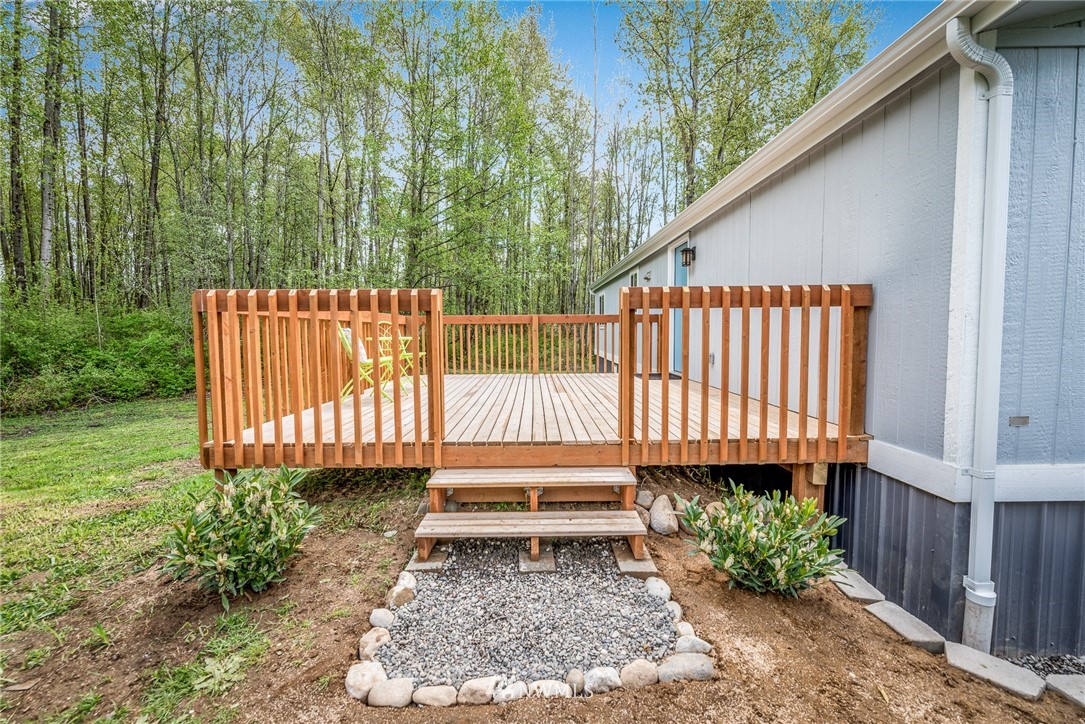 7992 Ham Road Custer, WA 98240 - Photo 22 of 31 a backyard of a house with a garden and deck