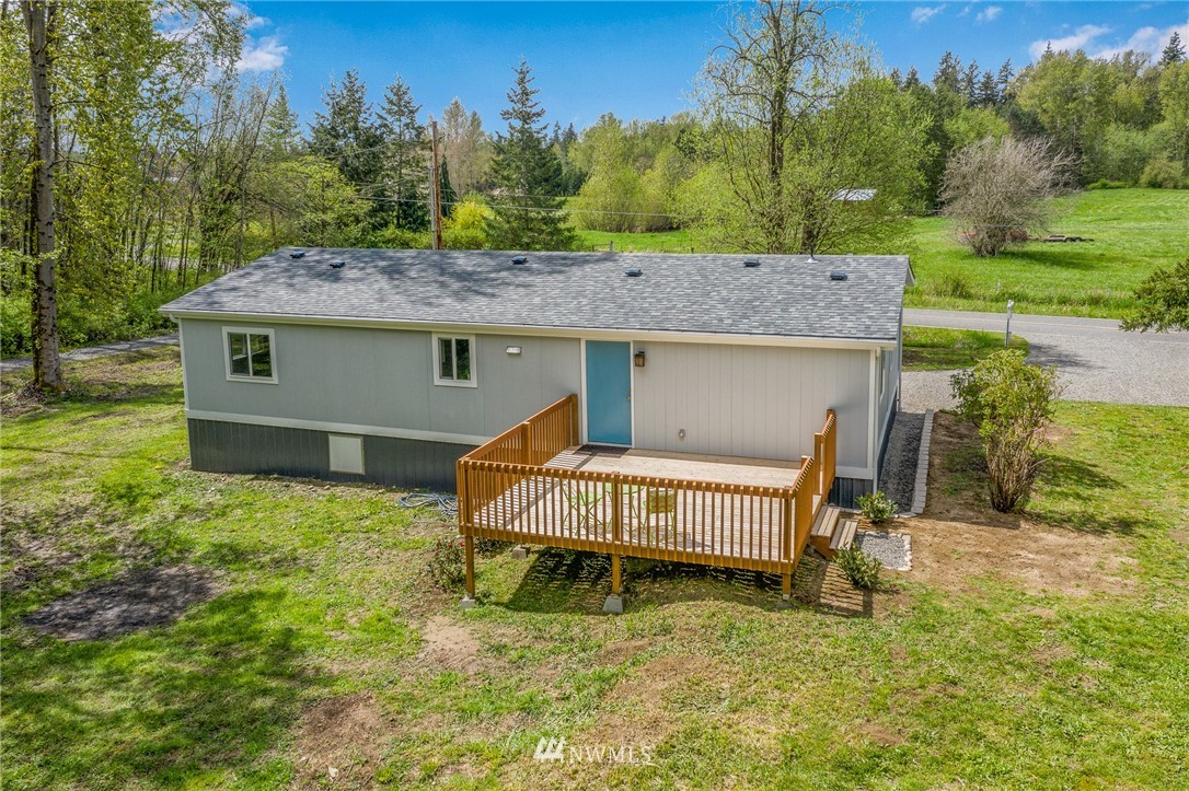 7992 Ham Road Custer, WA 98240 - Photo 29 of 31 a view of a house with a yard and sitting area