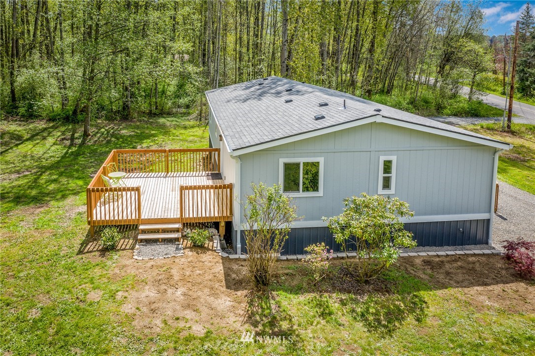 7992 Ham Road Custer, WA 98240 - Photo 30 of 31 a backyard of a house with table and chairs