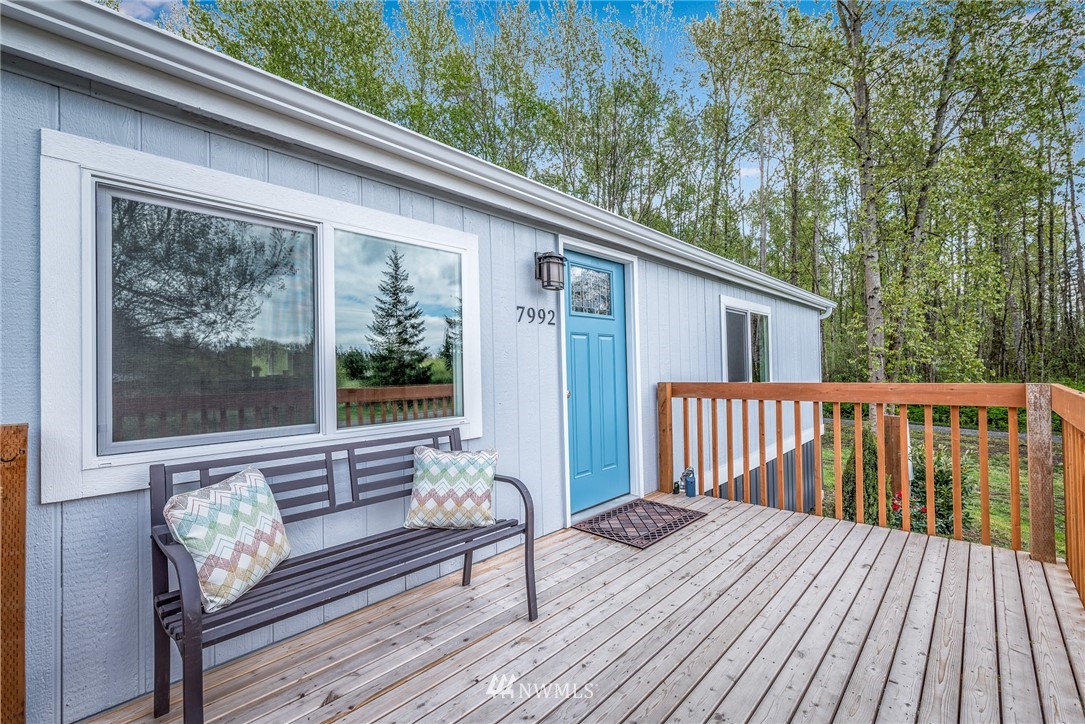 7992 Ham Road Custer, WA 98240 - Photo 31 of 31 a view of a wooden deck with furniture