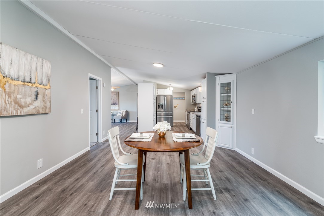 7992 Ham Road Custer, WA 98240 - Photo 9 of 31 a view of a dining room with furniture and wooden floor