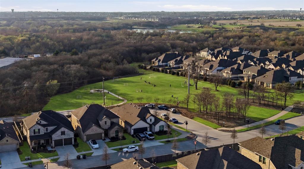 537 Oakmoss Street Little Elm, TX 76227 - Photo 31 of 39 an aerial view of a houses with a lake view