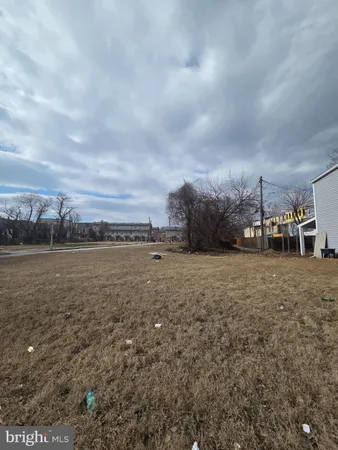 a view of a lake next to a yard