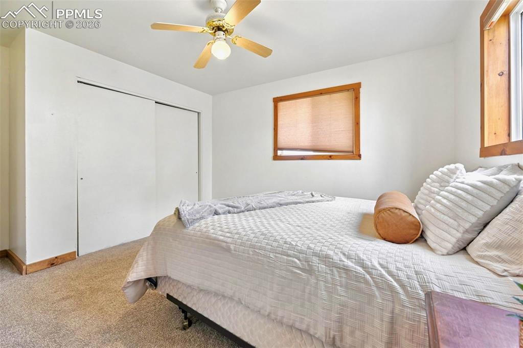 18560 Chelton Road Ramah, CO 80832 - Photo 13 of 34 a bedroom with a bed and window