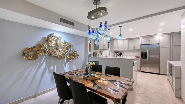 a kitchen with a table and chairs in it
