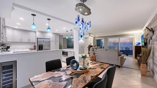 a kitchen with a stove and a chandelier