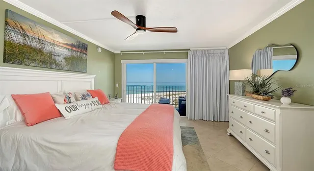 a bedroom with a bed and glass window