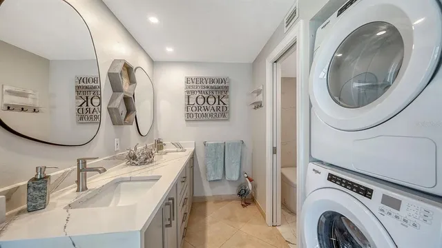 a bathroom with a double vanity sink and a mirror