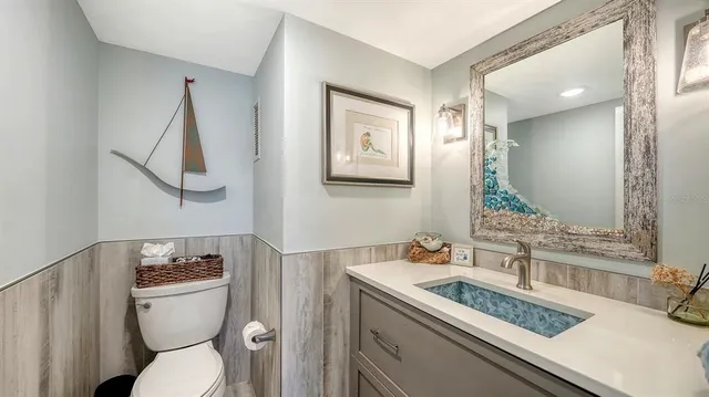 a view of a patio with couches chairs and wooden floor