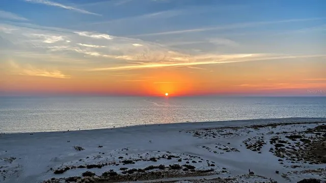 a living room with furniture and a pool table