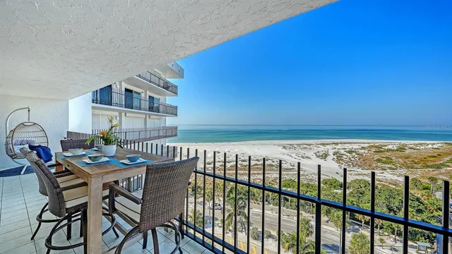 a view of a swimming pool with a lounge chairs