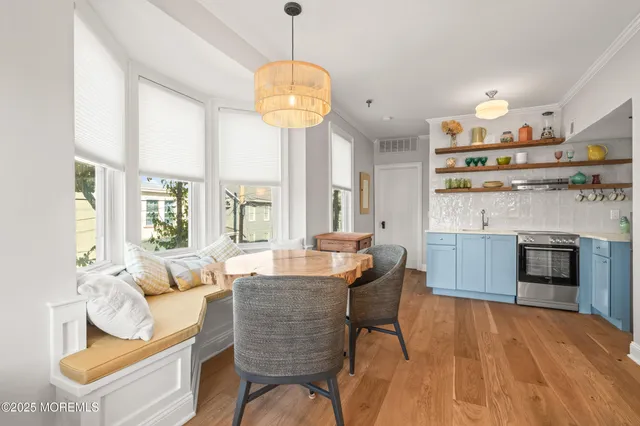 a bedroom with two beds and large window with outer view