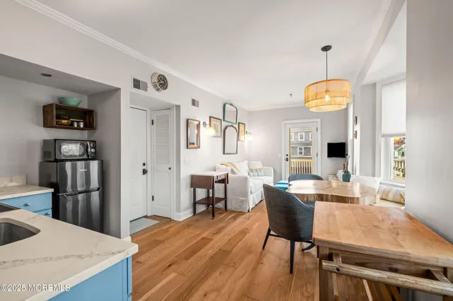 a kitchen with stainless steel appliances granite countertop a stove and a wooden cabinets