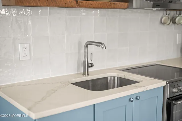 a bathroom with a sink vanity and a mirror