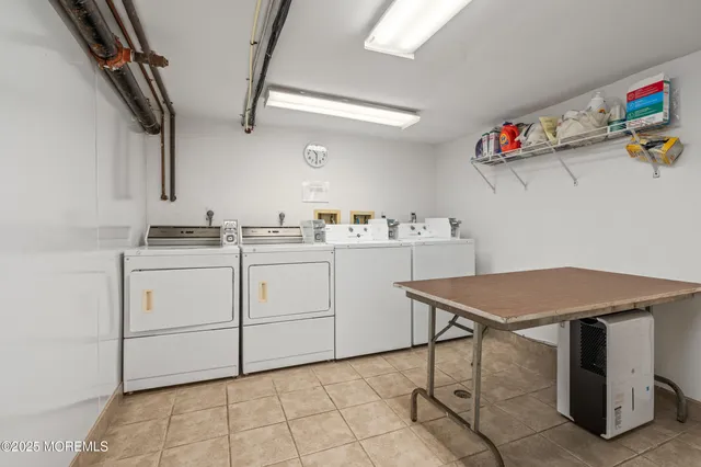 a view of an entryway with wooden floor and windows