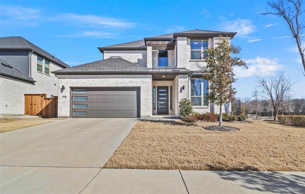 15996 Candletree Road Frisco, TX 75035 - Photo 1 of 1 a front view of a house with a yard