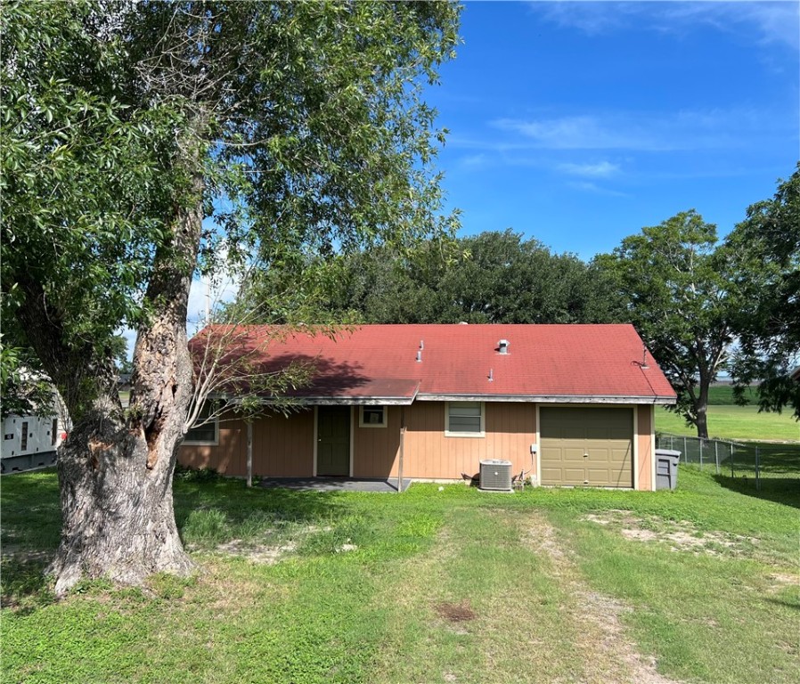 a view of a yard with an house and large trees