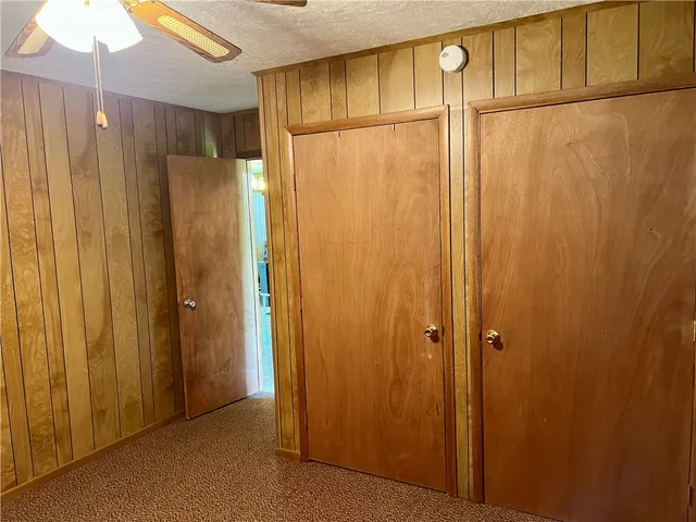 a room with musical instrument pool table and windows
