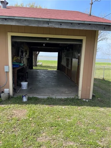 a view of a backyard with car parked