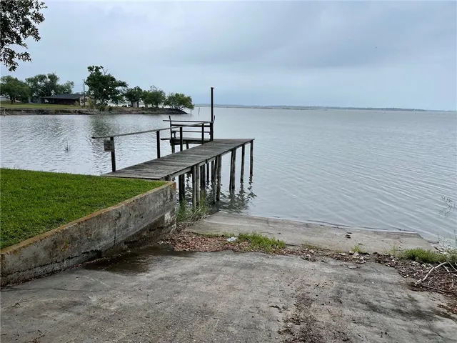a view of a terrace with wooden floor and lake view
