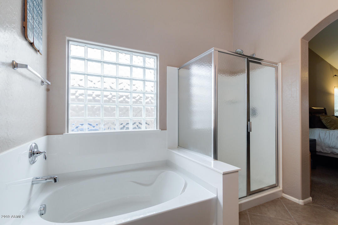 17776 West Charter Oak Road Surprise, AZ 85388 - Photo 19 of 35 a white bath tub sitting next to a window