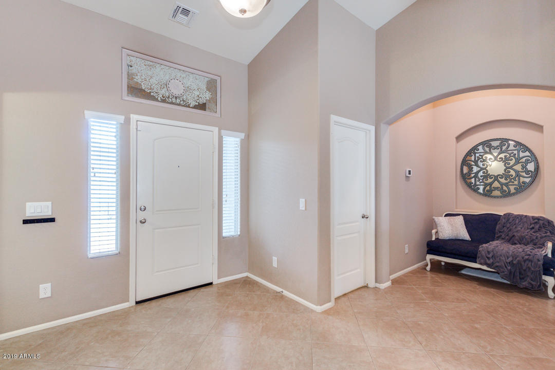 17776 West Charter Oak Road Surprise, AZ 85388 - Photo 3 of 35 an entryway with a workspace
