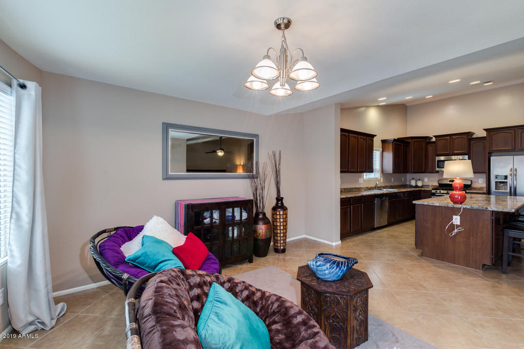 17776 West Charter Oak Road Surprise, AZ 85388 - Photo 32 of 35 a living room with furniture and kitchen view