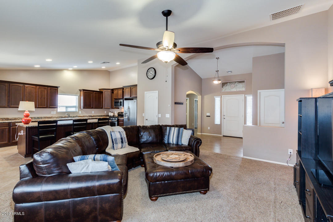 17776 West Charter Oak Road Surprise, AZ 85388 - Photo 6 of 35 a living room with furniture and kitchen view