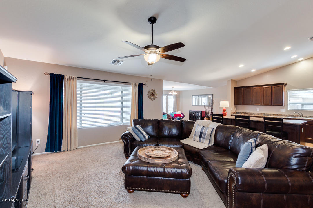 17776 West Charter Oak Road Surprise, AZ 85388 - Photo 7 of 35 a living room with furniture and a flat screen tv