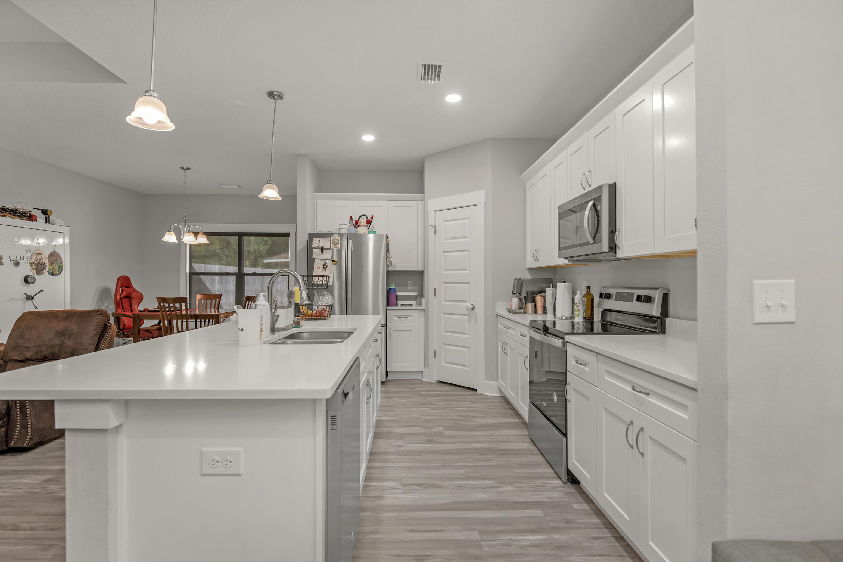 2800 Ram Lane Crestview, FL 32539 - Photo 11 of 24 a large kitchen with stainless steel appliances lots of counter space and breakfast area