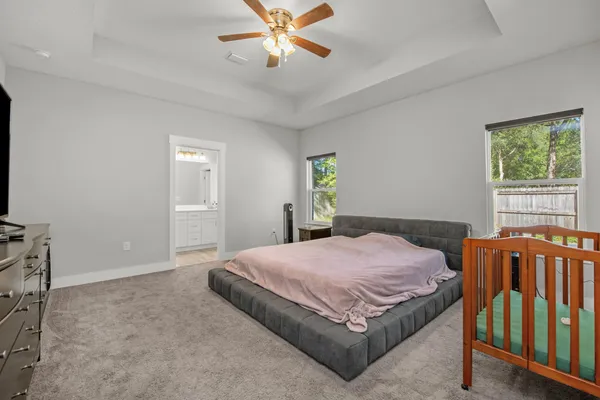 a bedroom with a bed and window