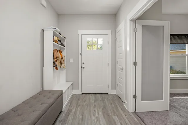 a view of entryway with wooden floor