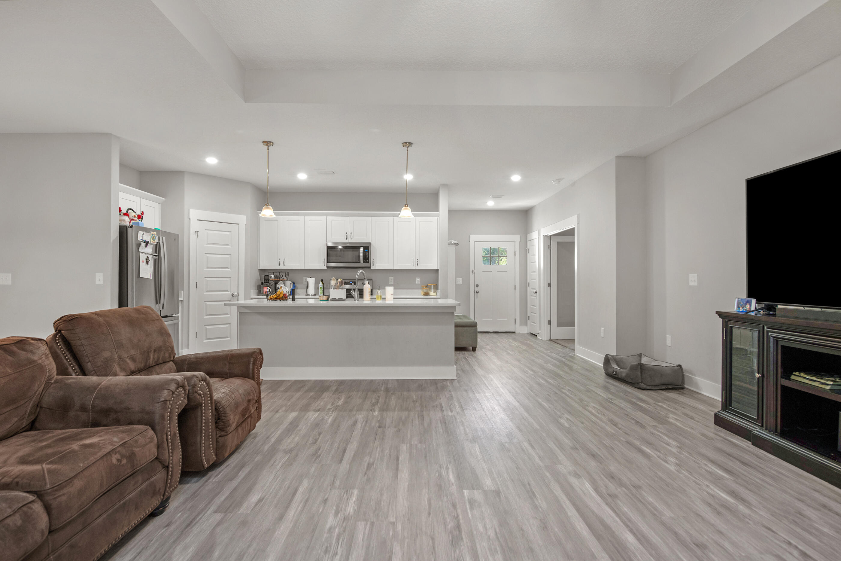 2800 Ram Lane Crestview, FL 32539 - Photo 8 of 24 a living room with furniture and a flat screen tv