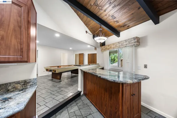 a kitchen with sink and stove