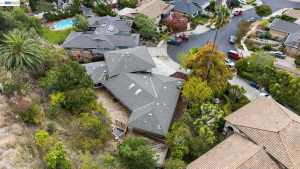 an aerial view of residential houses with outdoor space
