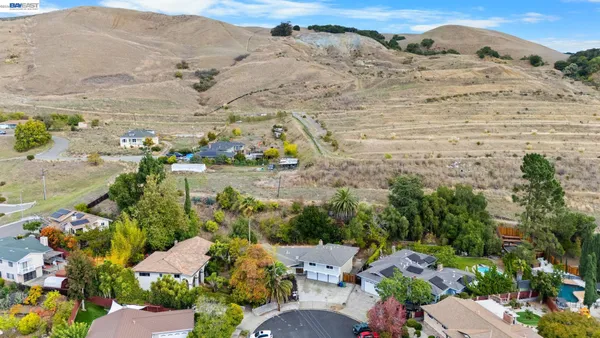 an aerial view of residential houses with outdoor space