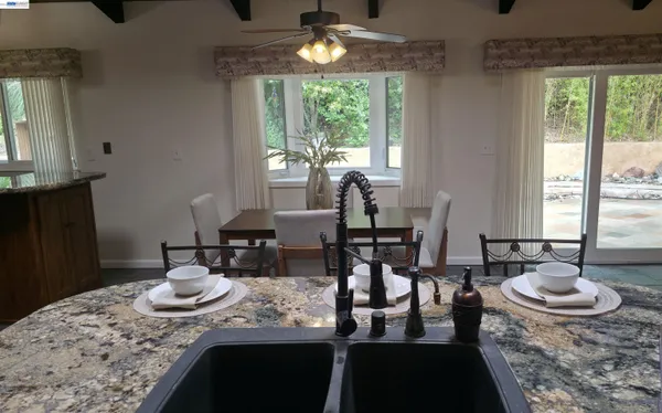 a view of a dining room with furniture window and outside view