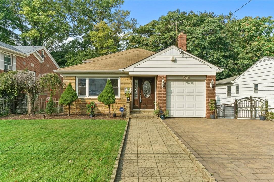 945 Split Rock Road Pelham, NY 10803 - Photo 1 of 1 a front view of a house with a yard
