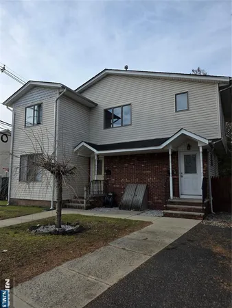 a front view of a house with garage