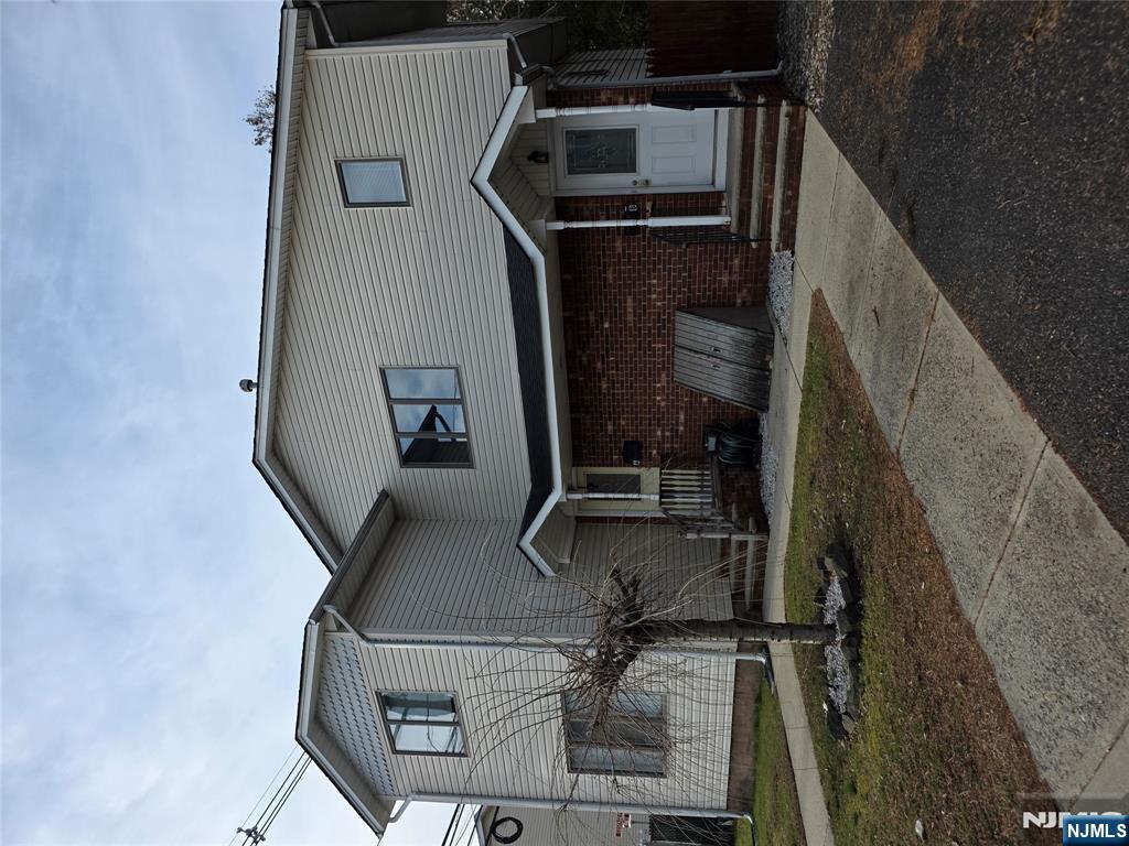 55 Cottage Place East Rutherford, NJ 07073 - Photo 1 of 2 a front view of a house with garage