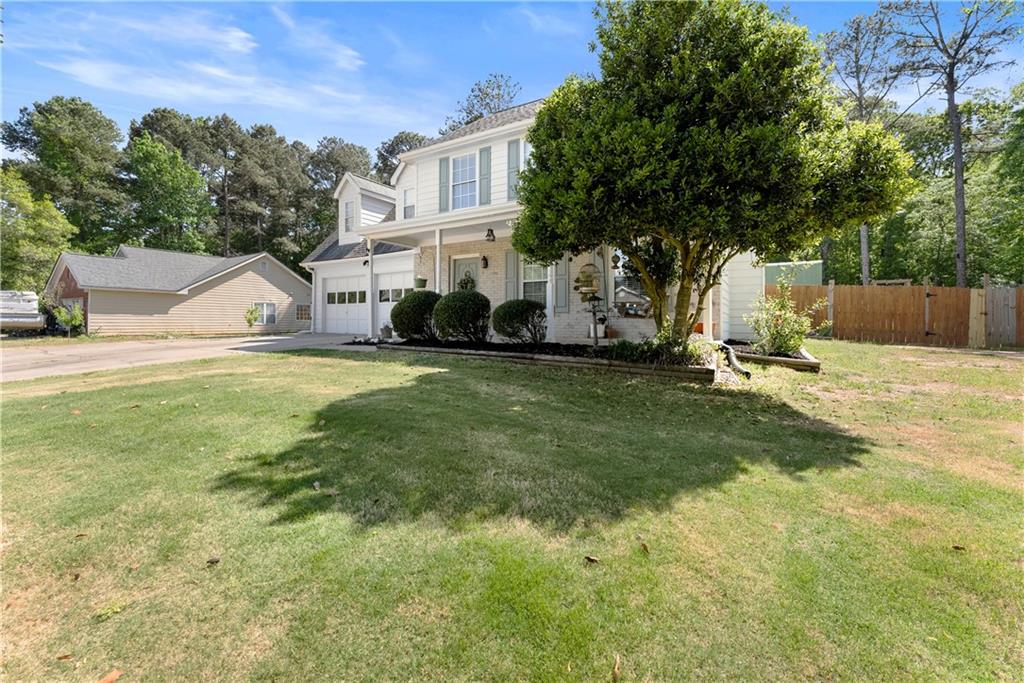 709 Muirfield Drive Winder, GA 30680 - Photo 12 of 65 a view of a house with a yard and sitting area