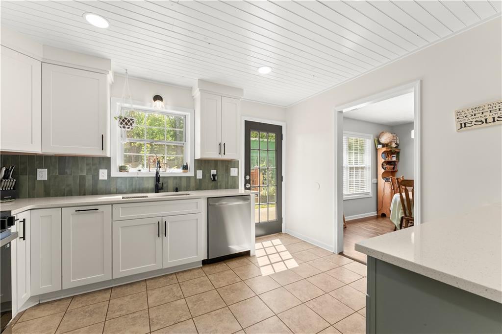 709 Muirfield Drive Winder, GA 30680 - Photo 20 of 65 a kitchen with a sink and cabinets