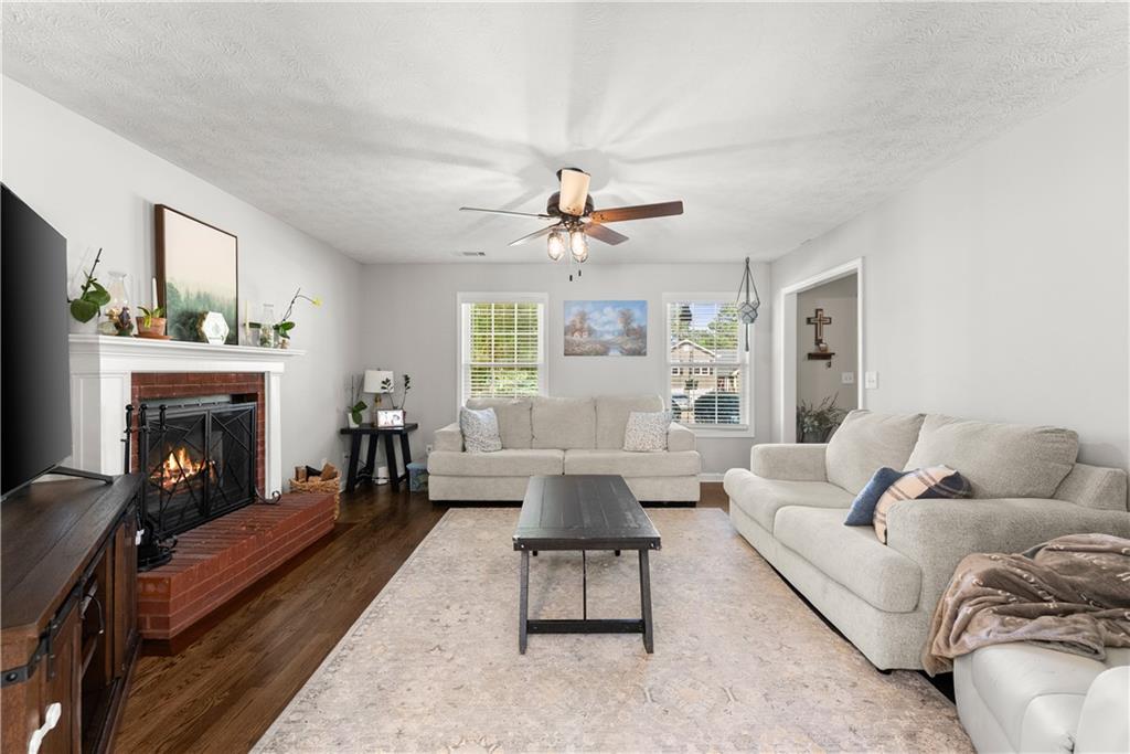 709 Muirfield Drive Winder, GA 30680 - Photo 2 of 65 a living room with furniture and a fireplace