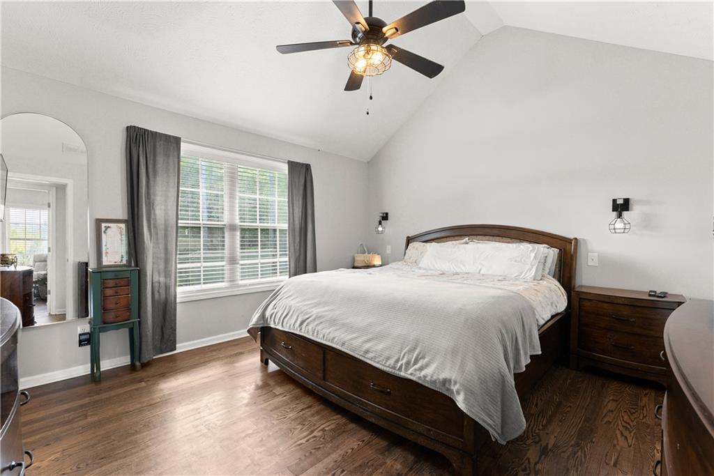 709 Muirfield Drive Winder, GA 30680 - Photo 26 of 65 a large bed sitting in a bedroom next to a window