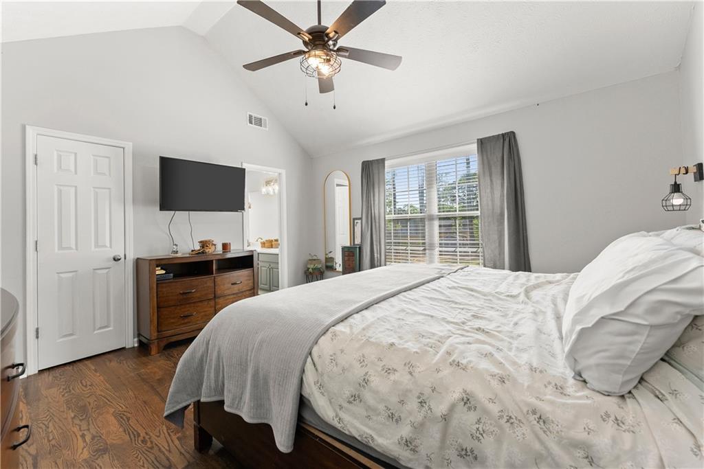 709 Muirfield Drive Winder, GA 30680 - Photo 27 of 65 a bedroom with a bed and a flat screen tv