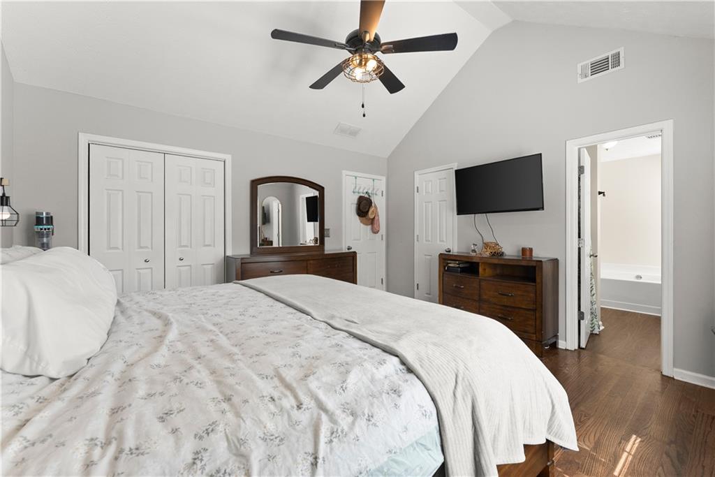709 Muirfield Drive Winder, GA 30680 - Photo 28 of 65 a bedroom with a bed and a flat screen tv