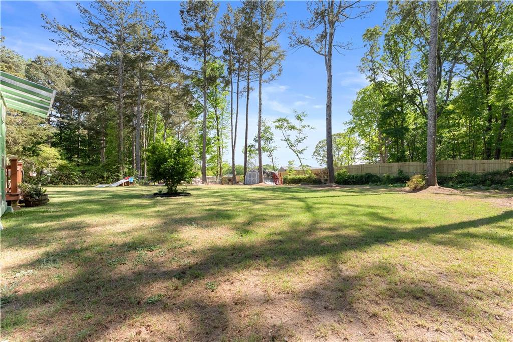 709 Muirfield Drive Winder, GA 30680 - Photo 46 of 65 a view of a yard with basketball court
