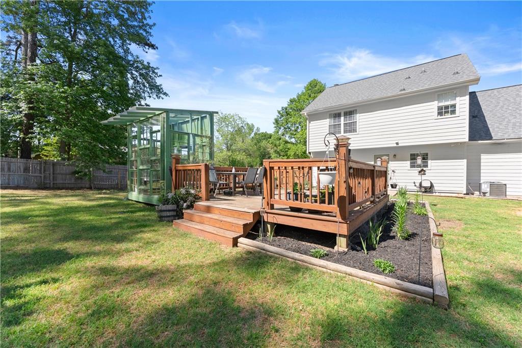709 Muirfield Drive Winder, GA 30680 - Photo 50 of 65 a outdoor view with a bench and garden